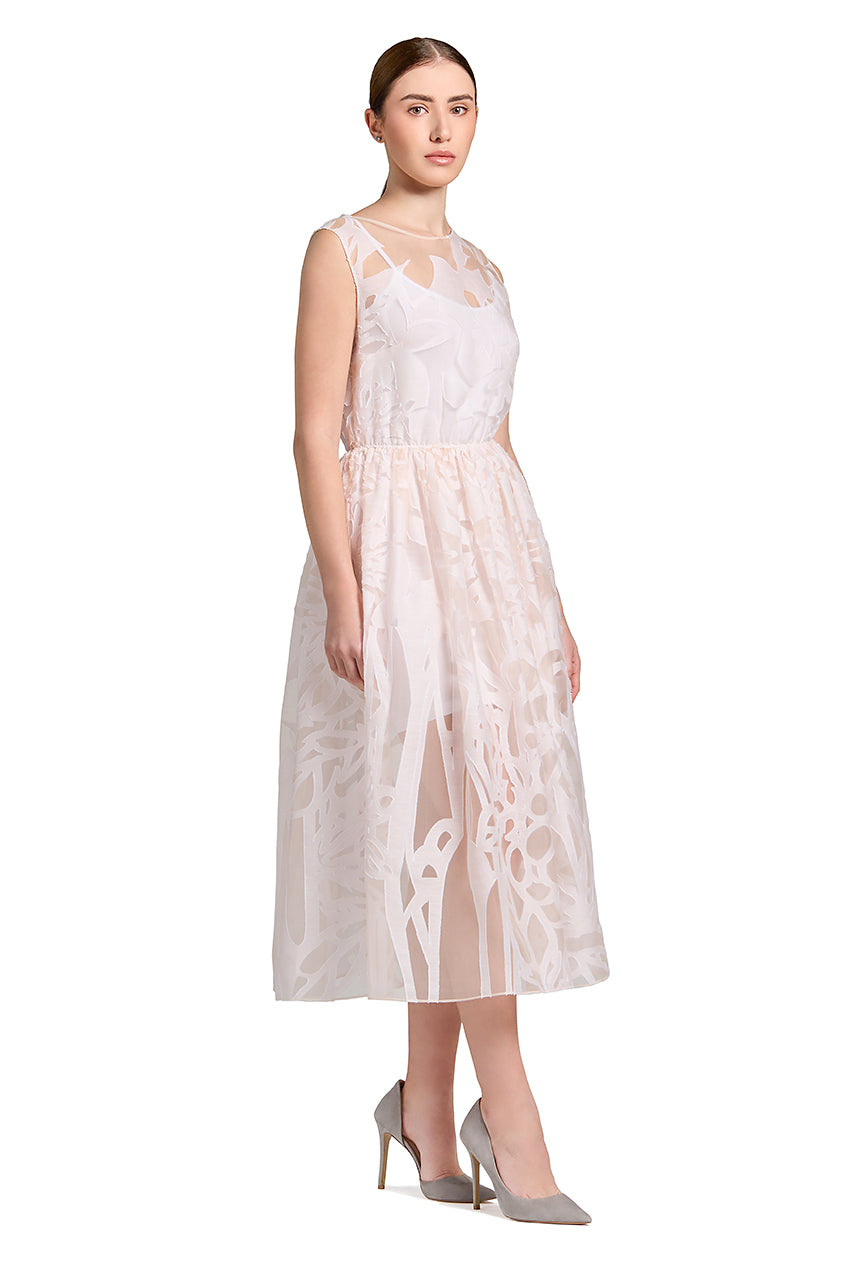 The cloud-like, super feminine dress is cut in delicate transparent off white silk fabric. This lightweight and elegant silhouette is composed of a carefully cinched waist creating understated pleating, and a skirt that lightly dusts the ankles.