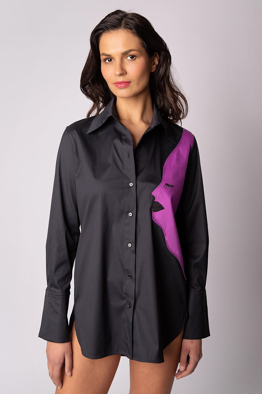 The original Juna shirt! Our signature women's shirt features a distinctive high collar and a relax silhouette. Cut from a luxurious stretch-cotton blend, it is accented with artwork inspired face appliqué attached to the garment with small transparent buttons for a look that is elegant  and playful. 